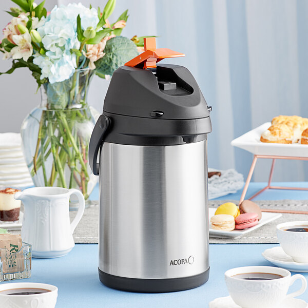 An Acopa stainless steel decaf airpot on a table.