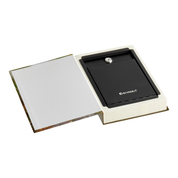 A steel security box with a key lock concealed inside a real book cover.