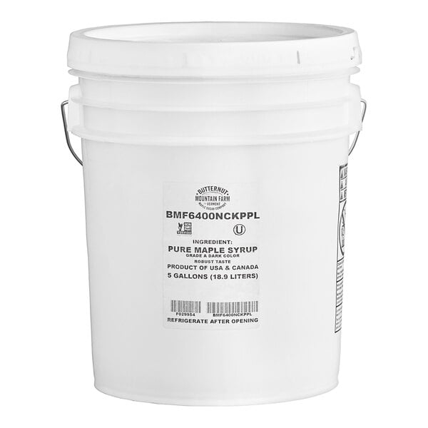 A white Butternut Mountain Farm bucket with a white lid and label.