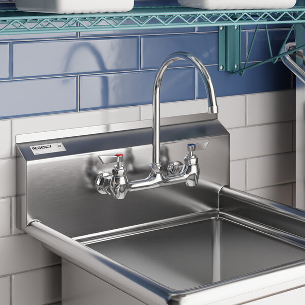 A stainless steel sink with a Waterloo 8-inch long gooseneck spout faucet featuring a 2 GPM aerator.