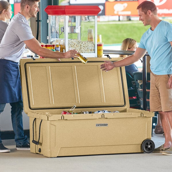 Two men opening a CaterGator outdoor cooler.