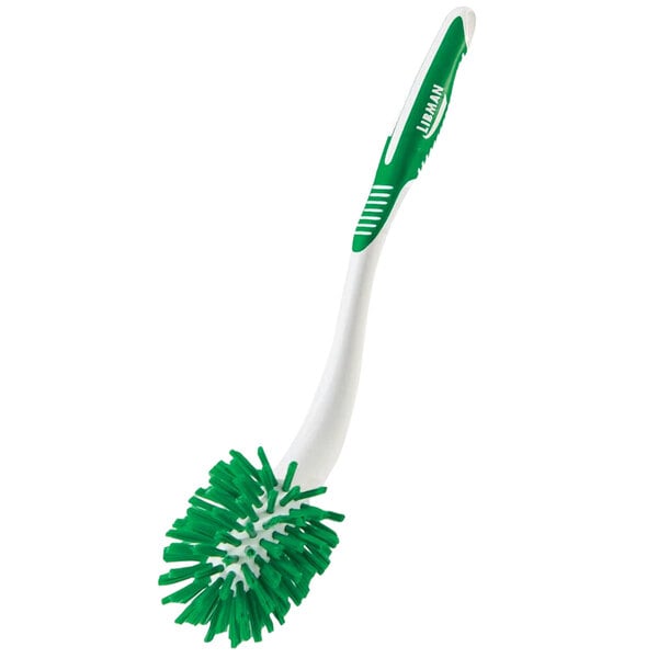 a green and white toothbrush