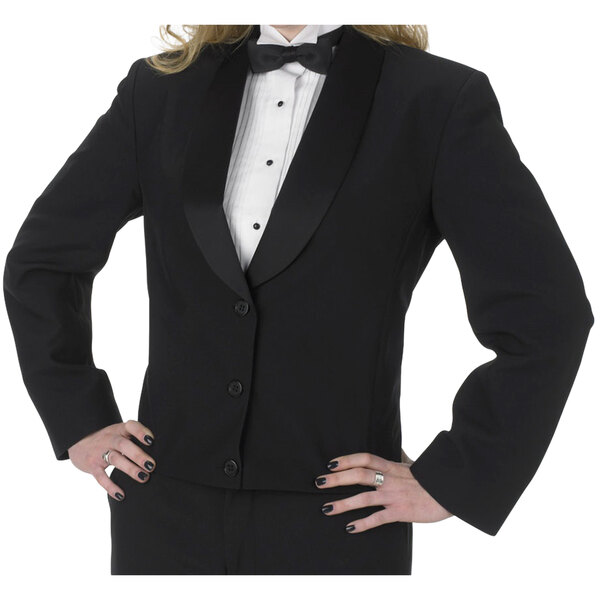 A woman wearing a Henry Segal black satin tuxedo jacket with shawl lapels.