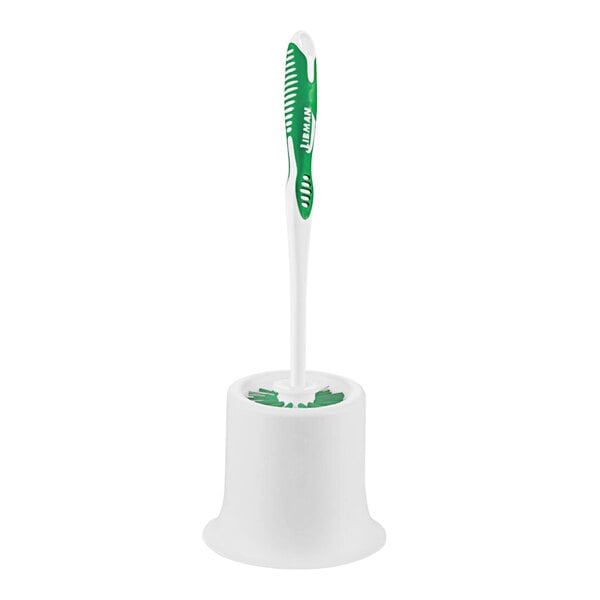 A white and green toilet bowl brush in an open caddy.