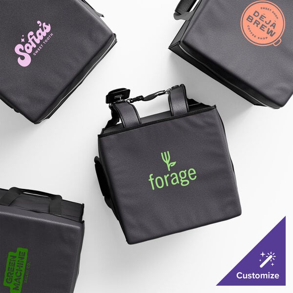 A group of four black Cambro GoBags with orange logos.