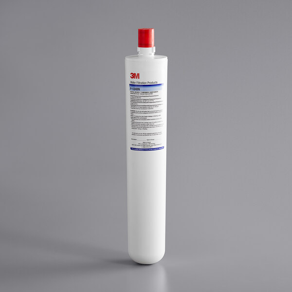 A white cylinder with a red cap.