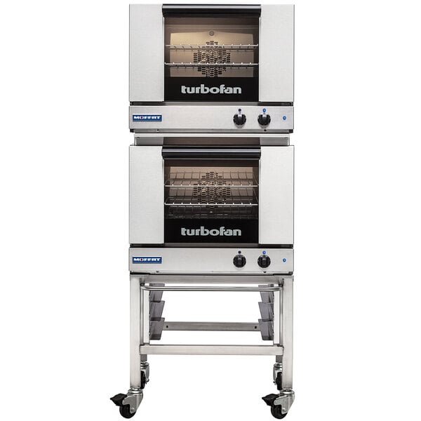 A Moffat Turbofan double stacking kit with casters for two convection ovens on wheels.