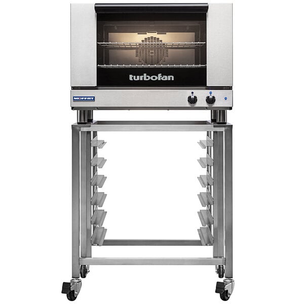 A silver and black Moffat convection oven on wheels.