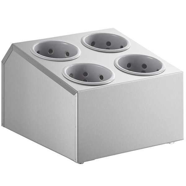 A white box with holes for four gray cylinders.