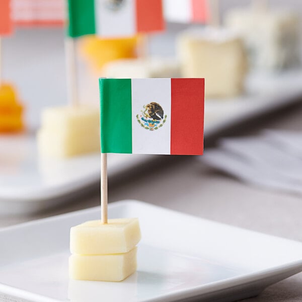 A Choice Mexican flag toothpick with cheese and crackers.