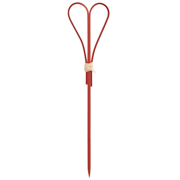 A red heart shaped bamboo skewer.