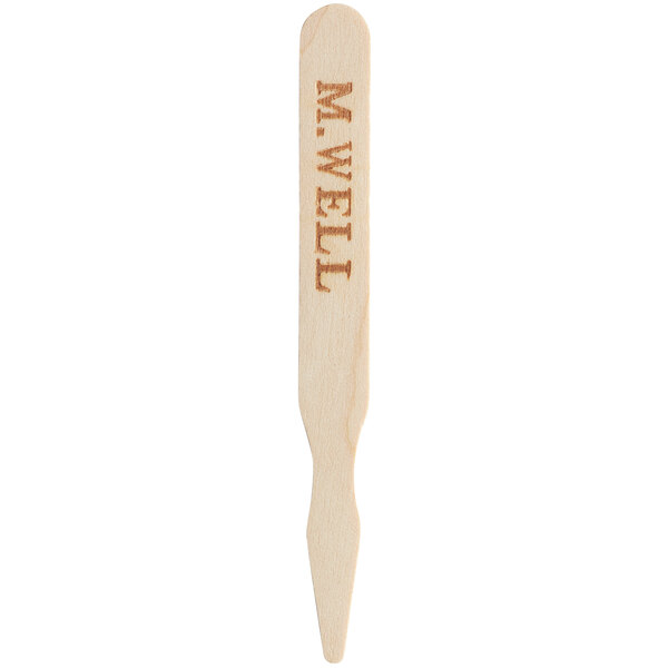 A TreeVive by EcoChoice wooden skewer with "Medium Well" engraved on it.
