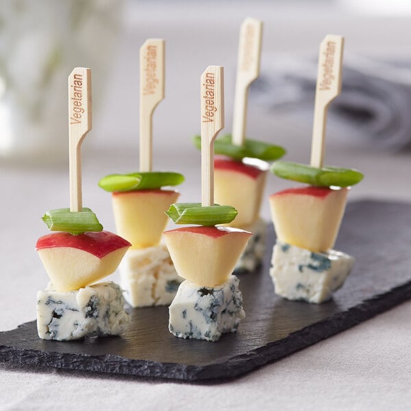 A piece of cheese and apple on a Bamboo by EcoChoice bamboo food pick.