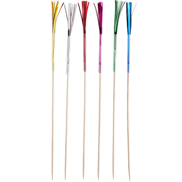 A group of Choice firework food picks with colorful feathers on the ends.