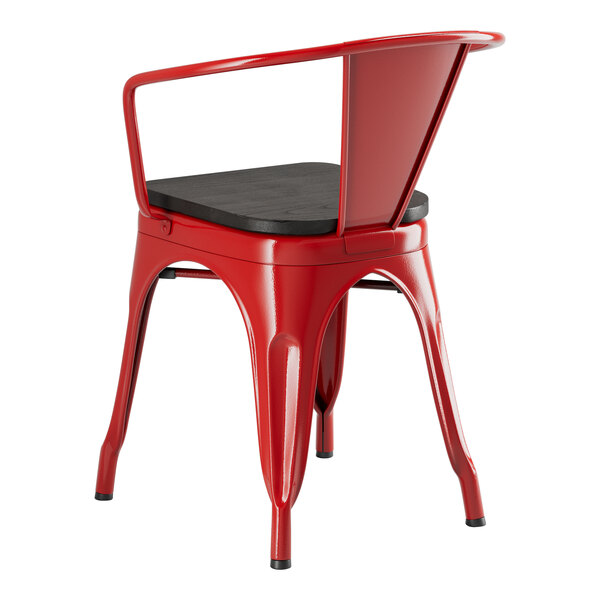 A red Lancaster Table & Seating metal arm chair with a black wood seat.
