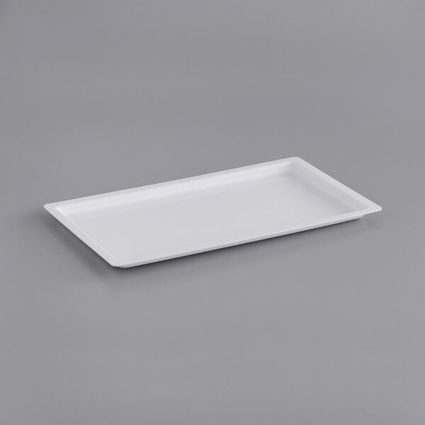 A white rectangular powder shield on a gray surface.