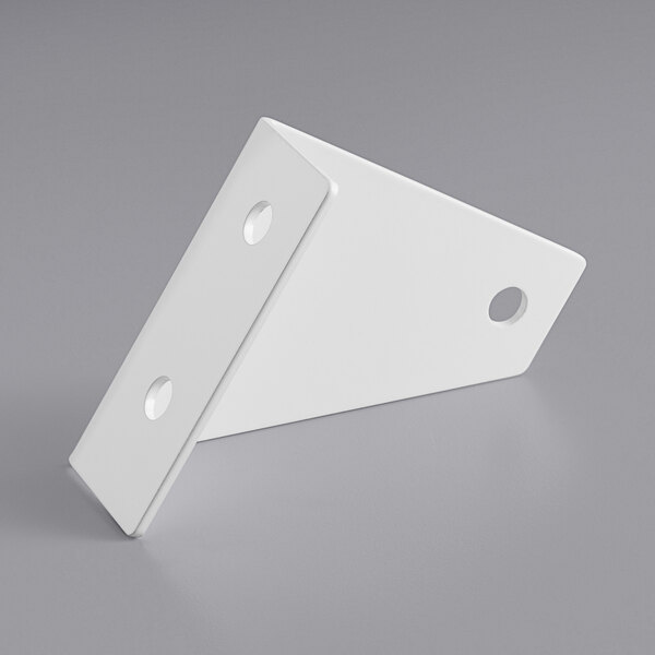 a white triangular object with holes