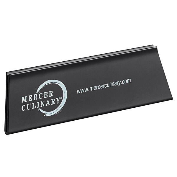 A black rectangular Mercer Culinary polypropylene blade guard with white text on a counter.