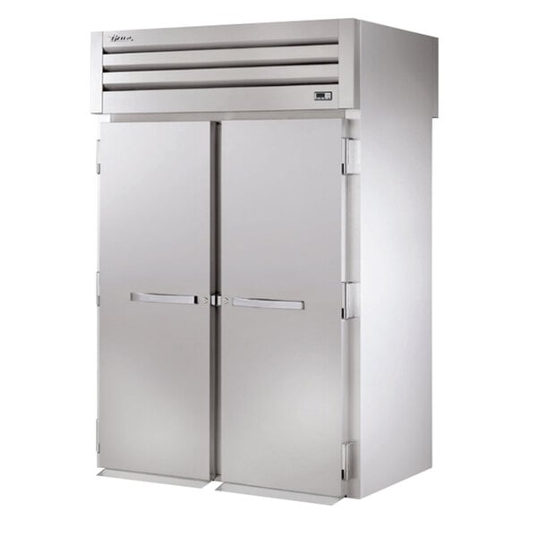 A white True roll-through refrigerator with two doors.