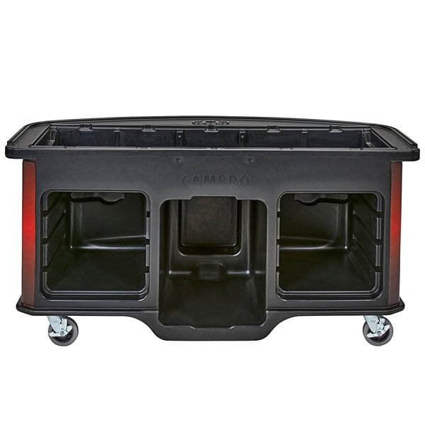 A black Cambro vending cart with a red laminated wrap over a black plastic container with three compartments on a table.