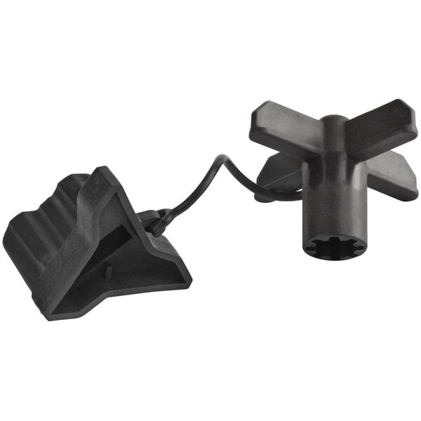 A black plastic blade removal tool with a black cord.