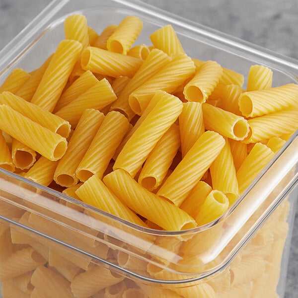 A white container of Barilla Rigatoni Pasta on a table.