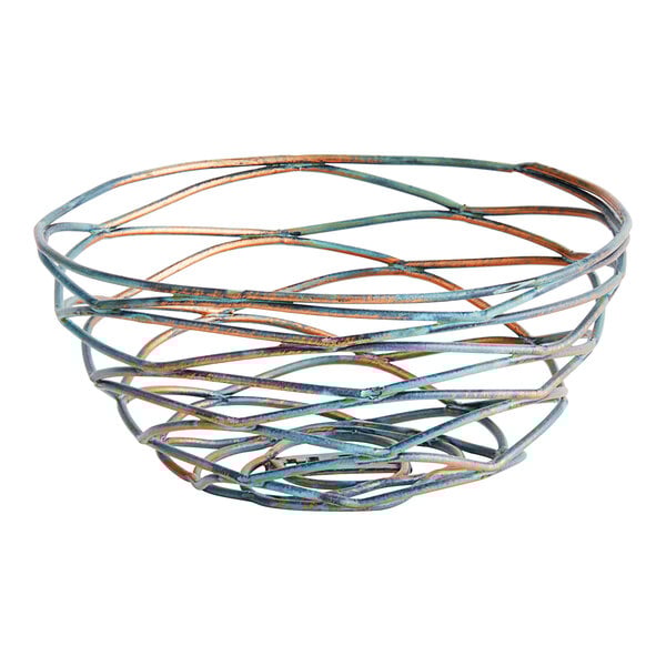 A Front of the House Patina fused iron round basket with a spiral design.
