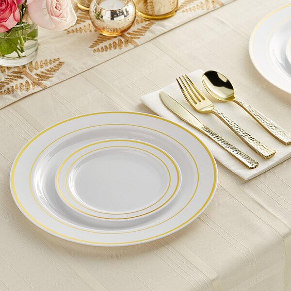 Gold Plates & Utensils on a Simple White Linen Table