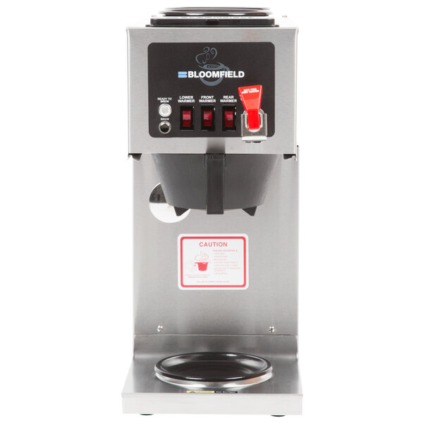 A silver and black Bloomfield automatic coffee maker with a red button.