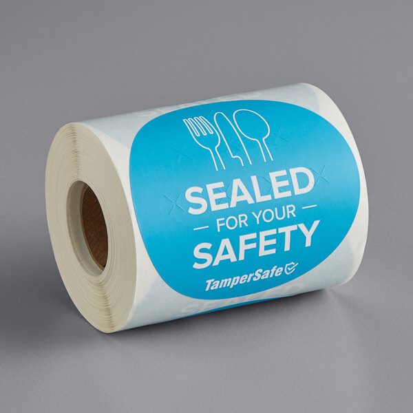A roll of blue TamperSafe labels with text that reads "Sealed For Your Safety"