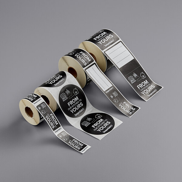 A roll of black TamperSafe paper labels with white text.