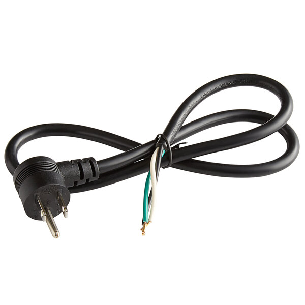 A close-up of a black electrical cord with a green wire attached to it.