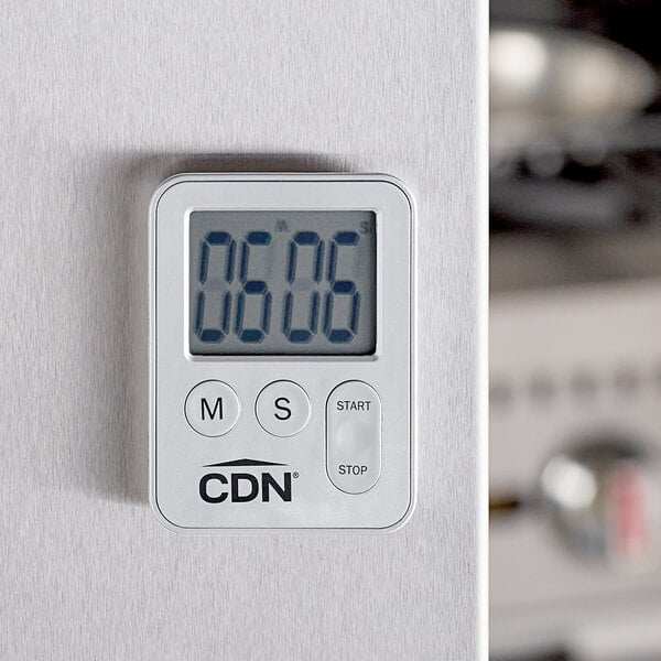 A silver CDN digital kitchen timer on a white surface.