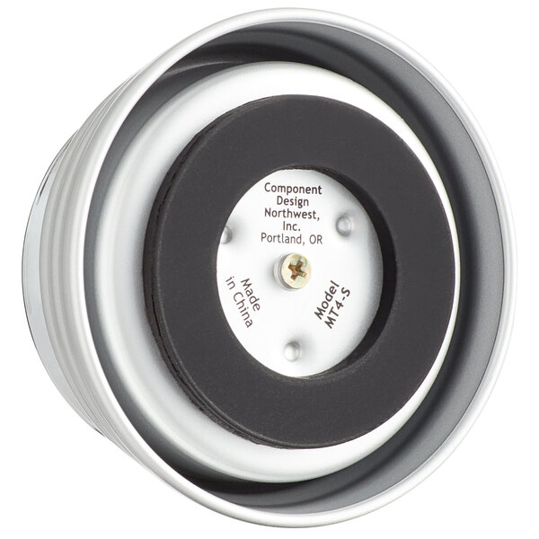 A close-up of a black and white circular mechanical kitchen timer with a screw on the back.