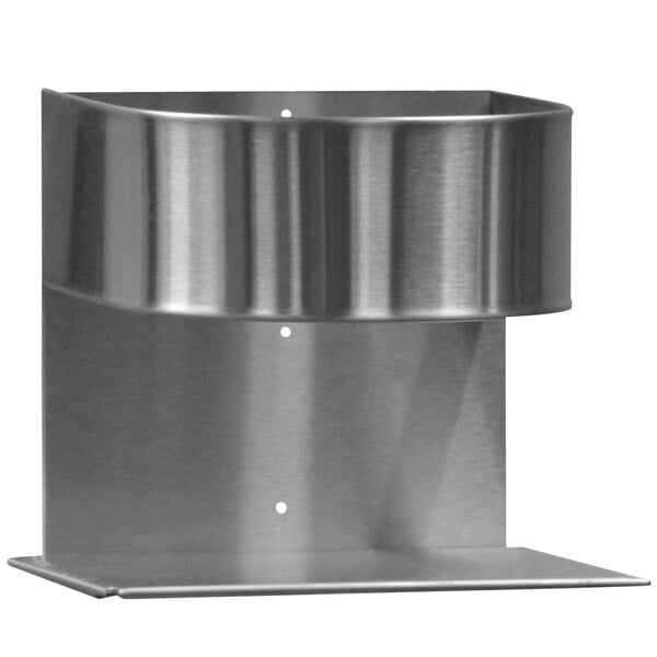 A Steril-Sil metal holder for a round metal container on a metal surface with holes.