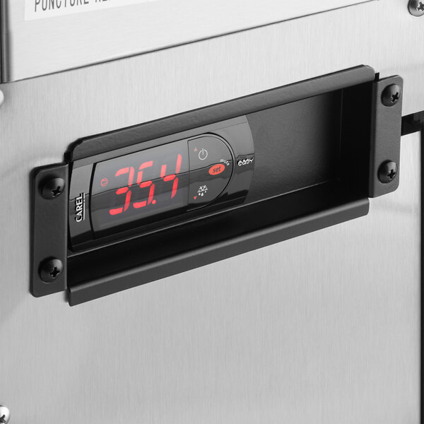 An Avantco stainless steel refrigerator with a digital display showing red numbers.