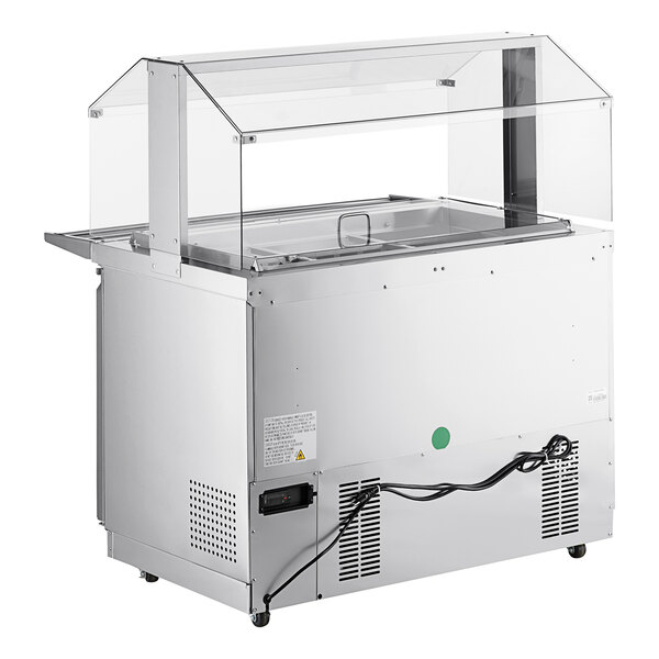 An Avantco stainless steel refrigerated salad bar with a clear cover on a counter.