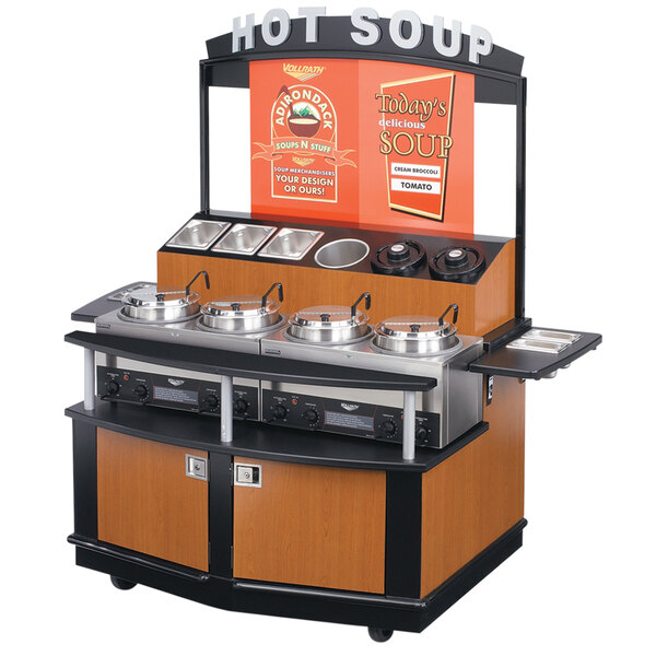 A Vollrath 6-Series Deluxe Soup Merchandiser Cart with pots of hot soup on it.