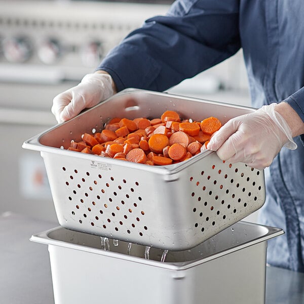 Carrots in a perforated steam table pan