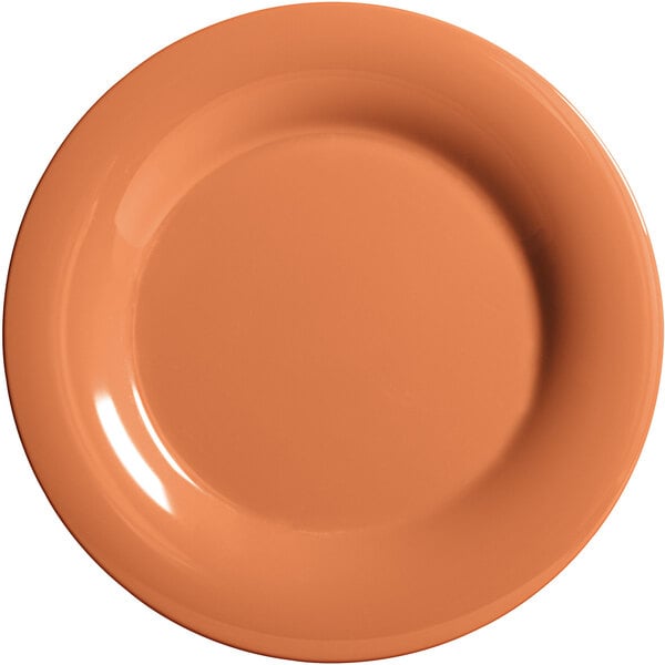 A close-up of a white GET Pumpkin Diamond Harvest melamine plate with a pumpkin design in the center.