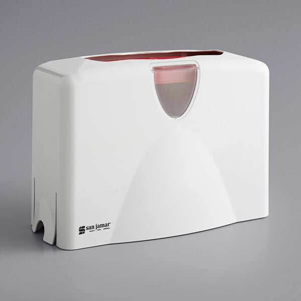 A white rectangular San Jamar countertop towel dispenser with a red lid.