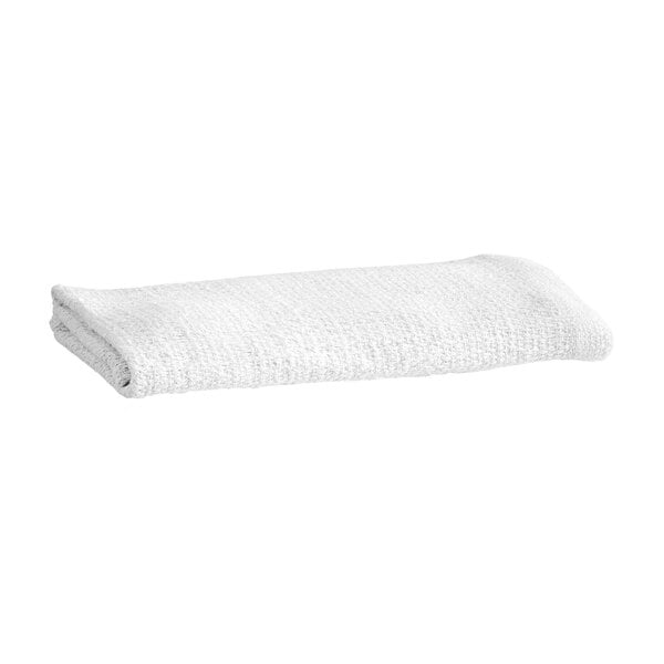 A folded white textured towel is shown against a plain background.