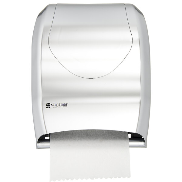 A stainless steel look San Jamar Tear-N-Dry paper towel dispenser with a roll of paper.