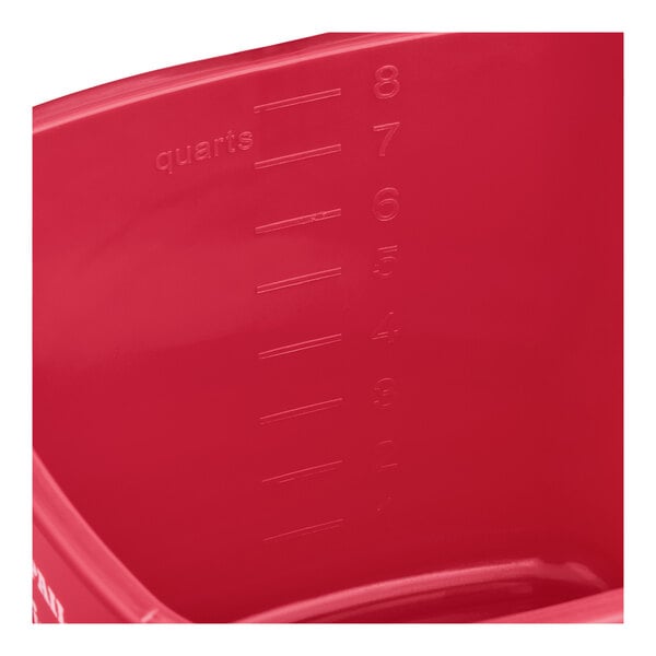 A red sanitizing pail with quart measurement markings on the inside.