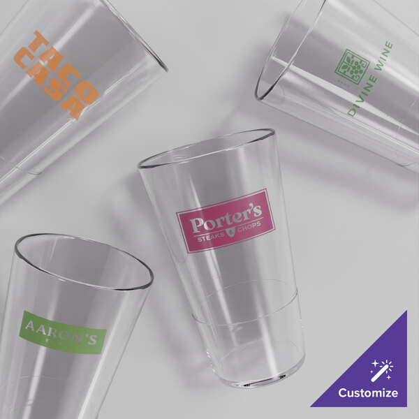 A group of Acopa Endure Tritan plastic highball glasses on a white surface.