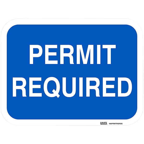 A blue aluminum sign with white text that says "Permit Required"