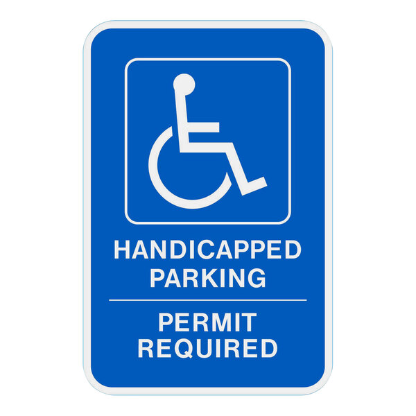 A blue sign with white letters that says "Handicapped Parking Permit Required" above a white handicap parking symbol.