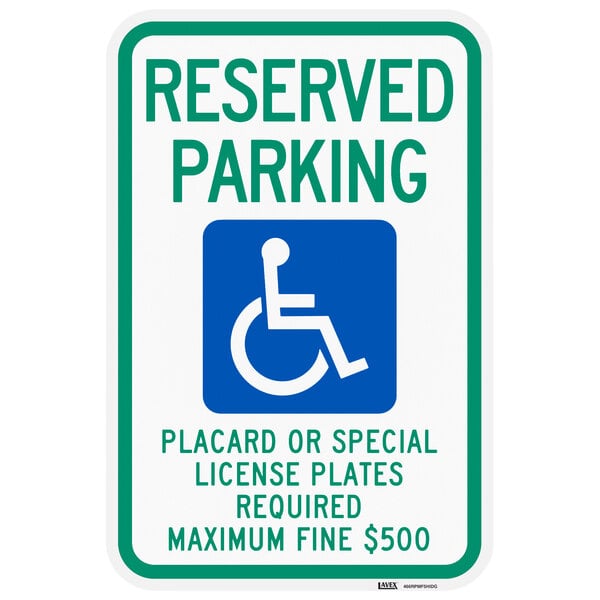 A green sign with white lettering reading "Handicapped Reserved Parking" and a white wheelchair symbol.