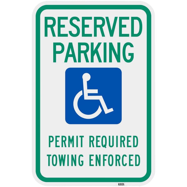A Lavex aluminum parking sign with a white handicap symbol and green and blue text that says "Handicapped Reserved Parking / Permit Required / Towing Enforced"