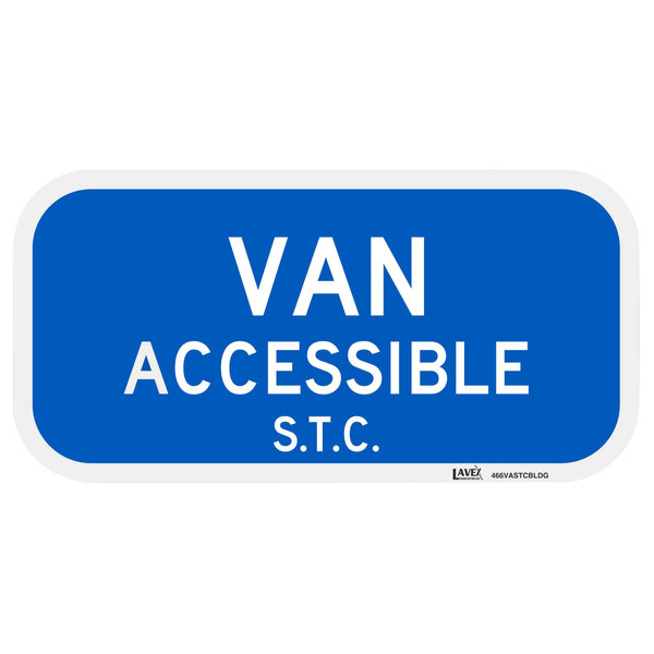 A blue aluminum sign with white text that says "Van Accessible / S.T.C."
